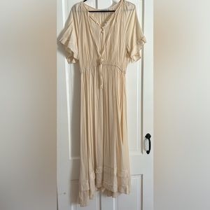 NWOT Beautiful sheer cream colored maxi dress.